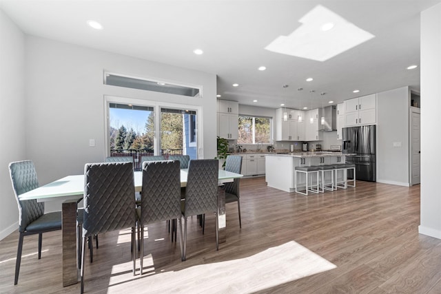 11625 N Alberta Ln, Spokane, WA 99218 - dining space with light wood finished floors, recessed lighting, and a skylight