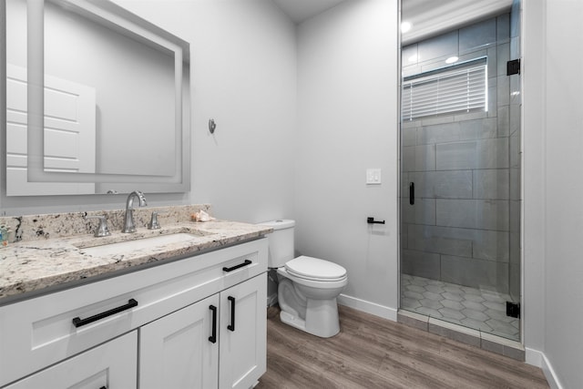 11625 N Alberta Ln, Spokane, WA 99218 - full bathroom with vanity, a stall shower, and wood finished floors