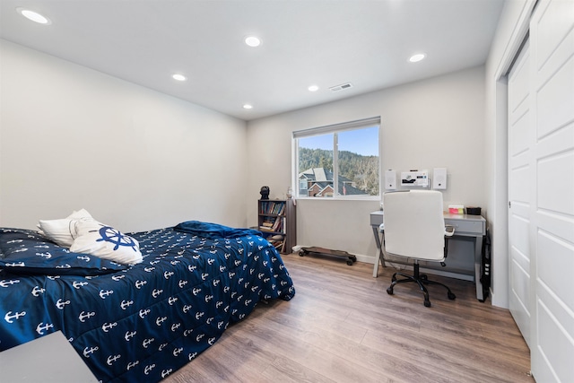 11625 N Alberta Ln, Spokane, WA 99218 - bedroom featuring wood finished floors and recessed lighting