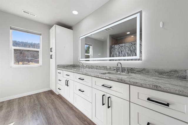 11625 N Alberta Ln, Spokane, WA 99218 - bathroom featuring double vanity, wood finished floors, and a shower with curtain