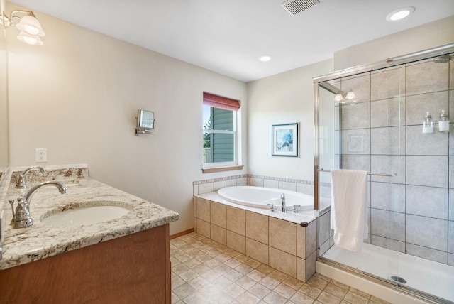 711 W Bolan Ave, Spokane, WA 99224 - bathroom featuring a garden tub, a shower stall, tile patterned flooring, and double vanity
