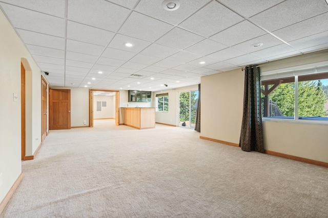 711 W Bolan Ave, Spokane, WA 99224 - unfurnished living room with light colored carpet, recessed lighting, and a drop ceiling