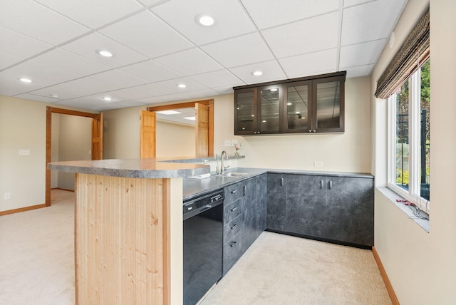 711 W Bolan Ave, Spokane, WA 99224 - kitchen featuring dishwasher, light colored carpet, a peninsula, glass insert cabinets, and recessed lighting