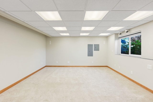 711 W Bolan Ave, Spokane, WA 99224 - empty room featuring electric panel, light colored carpet, and a paneled ceiling