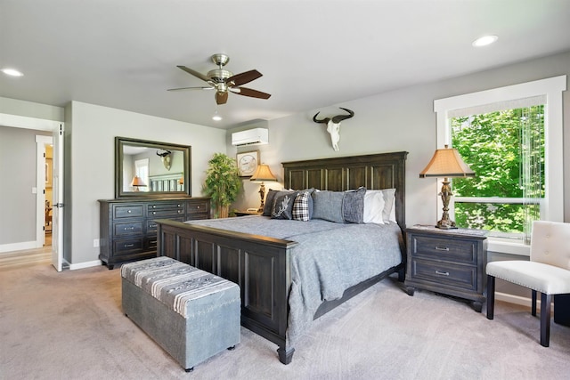 5159 W Village Blvd, Rathdrum, ID 83858 - bedroom featuring a wall mounted AC, light colored carpet, recessed lighting, and a ceiling fan
