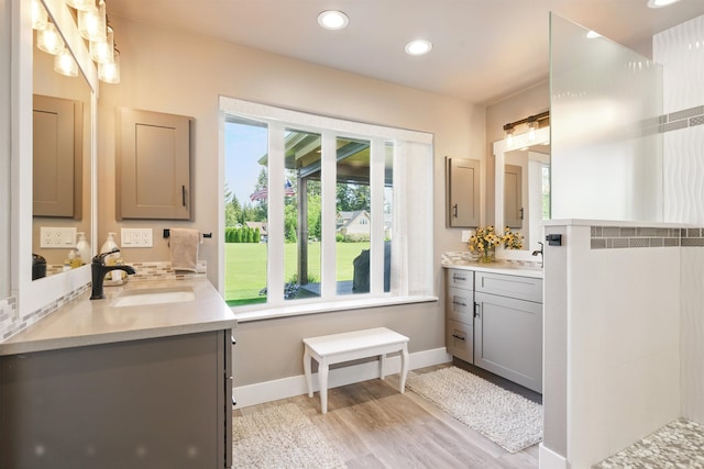 5159 W Village Blvd, Rathdrum, ID 83858 - full bathroom featuring two vanities, wood finished floors, and recessed lighting