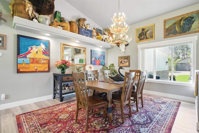 5159 W Village Blvd, Rathdrum, ID 83858 - dining space featuring a chandelier and wood finished floors