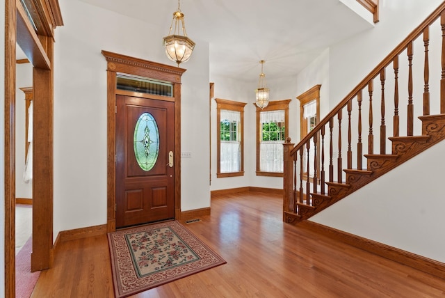 3810 E Evan Ln, Colbert, WA 99005 - foyer entrance featuring a chandelier, wood finished floors, and stairs
