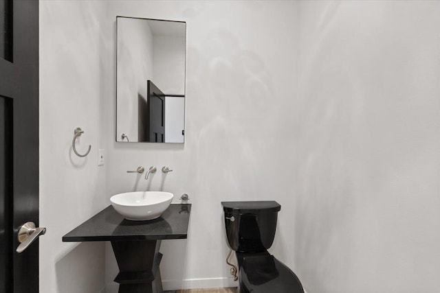 2503 S Thierman Ln, Spokane, WA 99223 - half bathroom featuring a sink