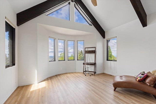 2503 S Thierman Ln, Spokane, WA 99223 - living area featuring beamed ceiling, wood finished floors, and high vaulted ceiling