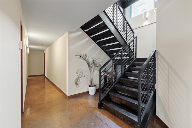 2503 S Thierman Ln, Spokane, WA 99223 - staircase with finished concrete flooring and baseboards