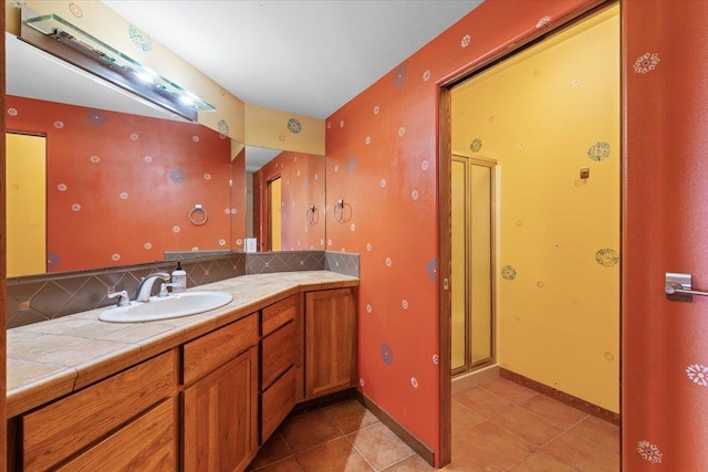 2503 S Thierman Ln, Spokane, WA 99223 - full bath with vanity, tile patterned flooring, decorative backsplash, and a shower stall