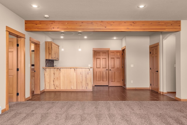 9510 N Doak Rd, Spokane, WA 99217 - kitchen with dark tile patterned floors, recessed lighting, dark colored carpet, beamed ceiling, and a peninsula