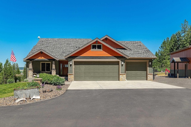 9510 N Doak Rd, Spokane, WA 99217 - craftsman house with stone siding, driveway, an attached garage, and a shingled roof