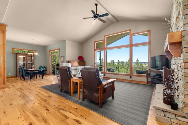 9510 N Doak Rd, Spokane, WA 99217 - living area with wood finished floors, a ceiling fan, and high vaulted ceiling