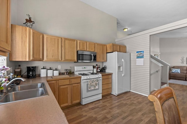 8910 N Oak St, Spokane, WA 99208 - kitchen with white appliances, a high ceiling, light countertops, and dark wood finished floors