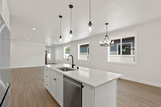 L4 E Sharp Ln, Spokane Valley, WA 99206 - kitchen featuring stainless steel dishwasher, light wood-style floors, open floor plan, white cabinetry, and hanging light fixtures