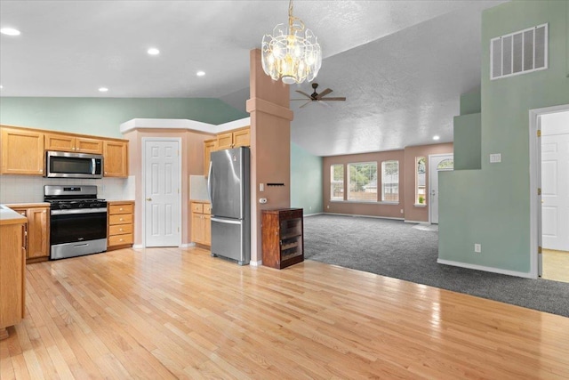 9301 N Drawbridge Ct, Hayden, ID 83835 - kitchen with appliances with stainless steel finishes, open floor plan, ceiling fan, light wood-style flooring, and light countertops