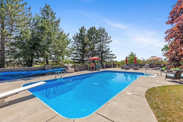 28752 Tramm Rd, Reardan, WA 99029 - view of pool with a diving board, a patio area, and outdoor lounge area