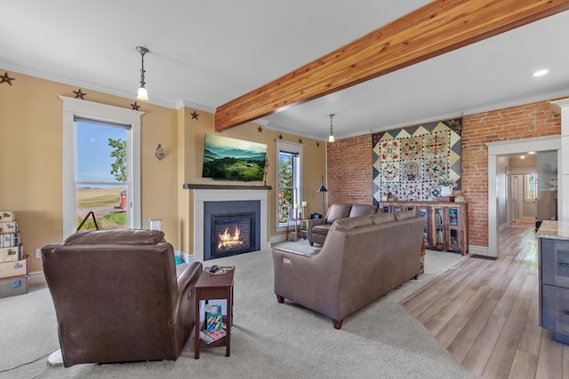28752 Tramm Rd, Reardan, WA 99029 - living area featuring a glass covered fireplace, brick wall, crown molding, beam ceiling, and light wood finished floors
