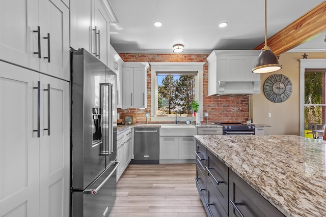 28752 Tramm Rd, Reardan, WA 99029 - kitchen featuring appliances with stainless steel finishes, plenty of natural light, light wood-style flooring, backsplash, and recessed lighting