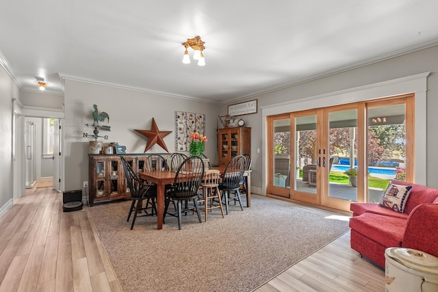 28752 Tramm Rd, Reardan, WA 99029 - dining area with french doors, healthy amount of natural light, light wood finished floors, and ornamental molding