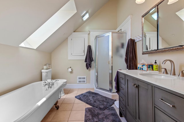 28752 Tramm Rd, Reardan, WA 99029 - bathroom with a skylight, vaulted ceiling, vanity, a shower stall, and a freestanding bath
