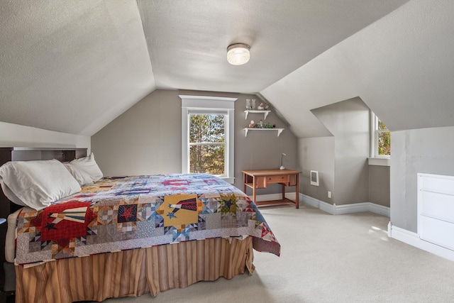 28752 Tramm Rd, Reardan, WA 99029 - bedroom featuring carpet, multiple windows, vaulted ceiling, and a textured ceiling