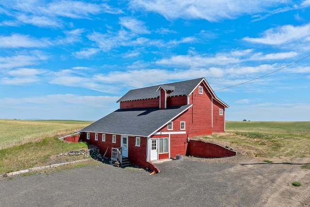 28752 Tramm Rd, Reardan, WA 99029 - view of property exterior featuring a barn, roof with shingles, and driveway
