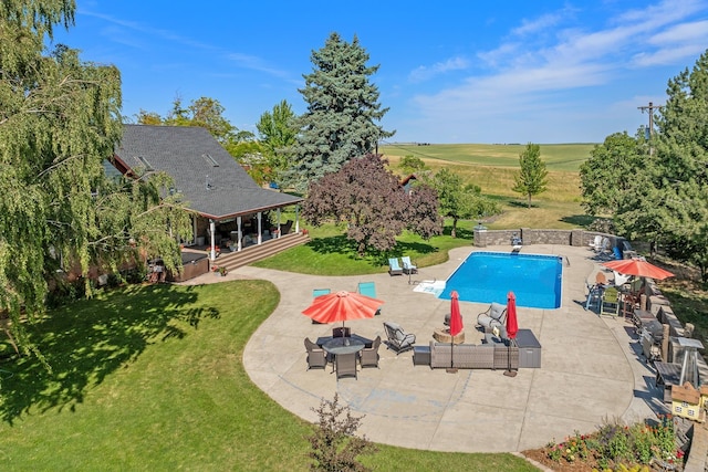 28752 Tramm Rd, Reardan, WA 99029 - outdoor pool featuring a jacuzzi, a patio, and a lawn