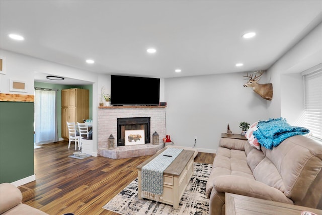 10946 W Sagewood Rd, Nine Mile Falls, WA 99026 - living room with wood finished floors, a brick fireplace, and recessed lighting