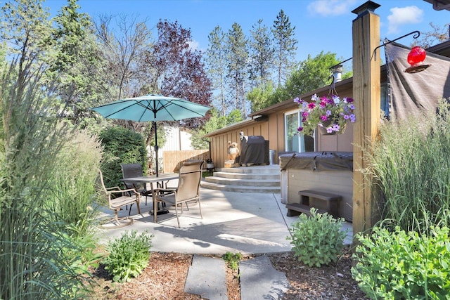 10946 W Sagewood Rd, Nine Mile Falls, WA 99026 - view of patio / terrace with a hot tub and outdoor dining space