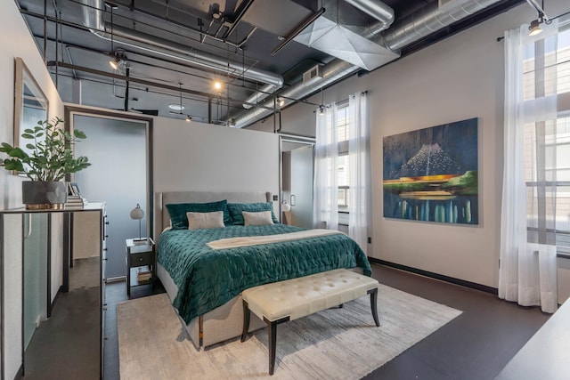 2230 W Riverside Ave # 302, Spokane, WA 99201 - bedroom with finished concrete floors and a high ceiling