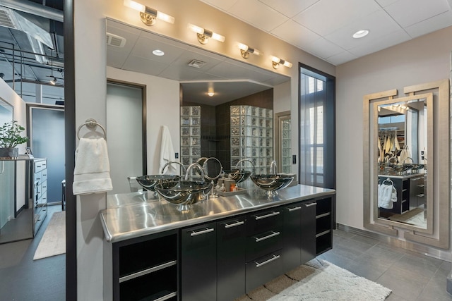 2230 W Riverside Ave # 302, Spokane, WA 99201 - full bathroom featuring vanity, tile patterned flooring, and a paneled ceiling