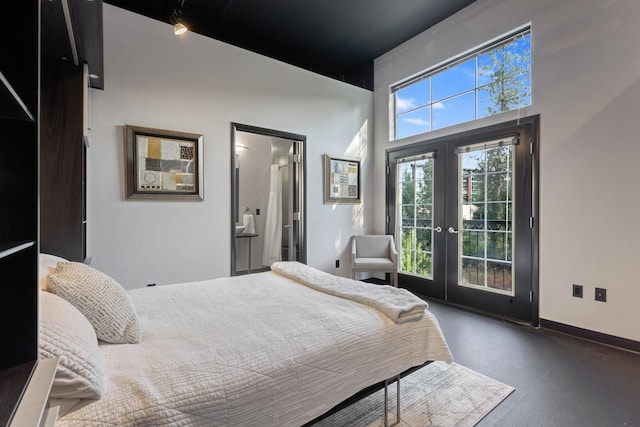 2230 W Riverside Ave # 302, Spokane, WA 99201 - bedroom with french doors, access to outside, a towering ceiling, and ensuite bathroom