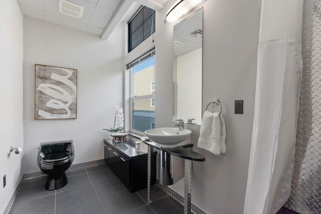 2230 W Riverside Ave # 302, Spokane, WA 99201 - bathroom featuring tile patterned flooring and curtained shower