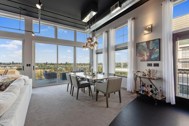 2230 W Riverside Ave # 302, Spokane, WA 99201 - sunroom / solarium featuring healthy amount of natural light and a chandelier
