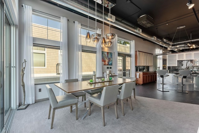 2230 W Riverside Ave # 302, Spokane, WA 99201 - dining area with a towering ceiling and a chandelier