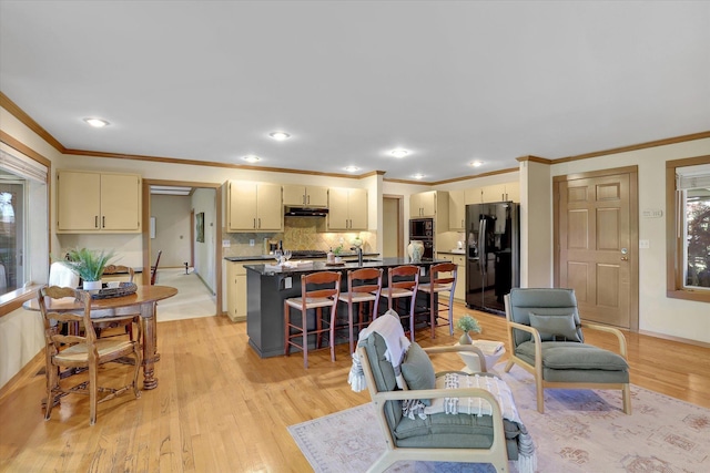 4402 S Saint Andrews Ln, Spokane, WA 99223 - living area with ornamental molding, light wood-style floors, healthy amount of natural light, and recessed lighting