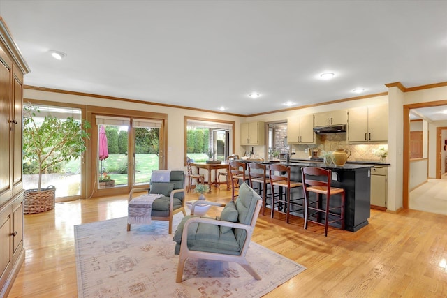 4402 S Saint Andrews Ln, Spokane, WA 99223 - living room featuring ornamental molding, plenty of natural light, light wood-type flooring, and recessed lighting