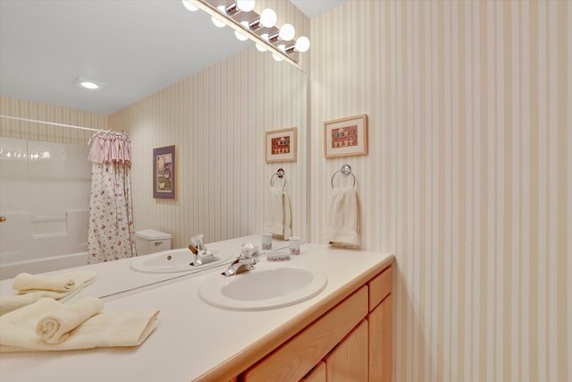 4402 S Saint Andrews Ln, Spokane, WA 99223 - full bathroom with vanity, shower / bathtub combination with curtain, and wallpapered walls