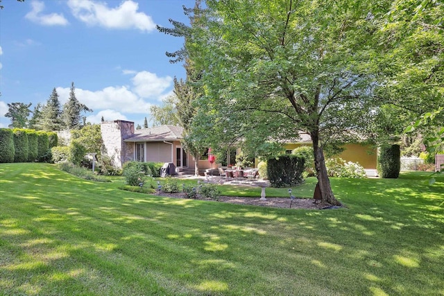 4402 S Saint Andrews Ln, Spokane, WA 99223 - view of grassy yard with a patio area