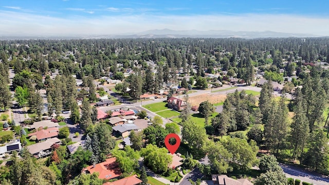 4402 S Saint Andrews Ln, Spokane, WA 99223 - aerial view of property and surrounding area featuring a mountain backdrop and nearby suburban area