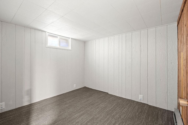 3307 W Euclid Ave, Spokane, WA 99205 - below grade area with carpet floors, wood walls, and baseboard heating