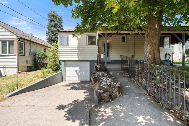 3307 W Euclid Ave, Spokane, WA 99205 - view of front facade featuring a garage and concrete driveway