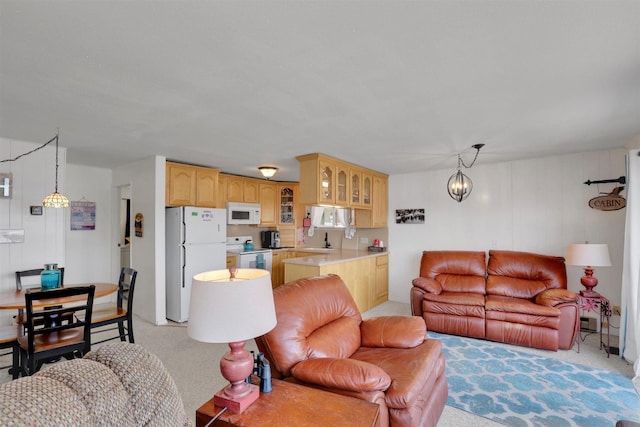 22704 E Park Beach Rd, Newman Lake, WA 99025 - living room featuring light carpet and a chandelier
