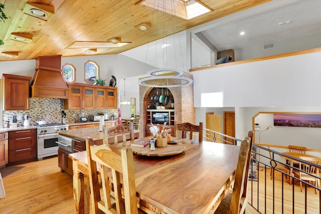 10612 E 46th Ave, Spokane Valley, WA 99206 - dining space featuring lofted ceiling, light wood-style floors, and wooden ceiling