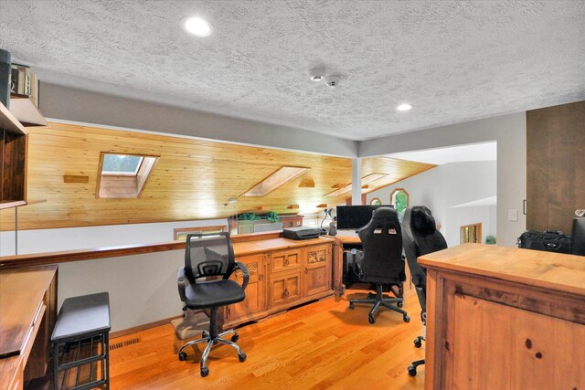 10612 E 46th Ave, Spokane Valley, WA 99206 - office area with light wood-style flooring, recessed lighting, a textured ceiling, and a skylight