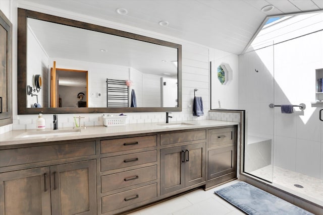 10612 E 46th Ave, Spokane Valley, WA 99206 - full bath featuring double vanity, a stall shower, tile patterned floors, and lofted ceiling