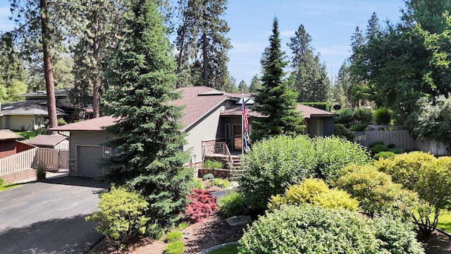 10612 E 46th Ave, Spokane Valley, WA 99206 - view of side of home with stucco siding, asphalt driveway, stairway, and an attached garage